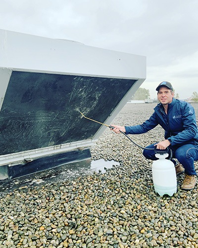 Western Pacific commercial HVAC technician at work