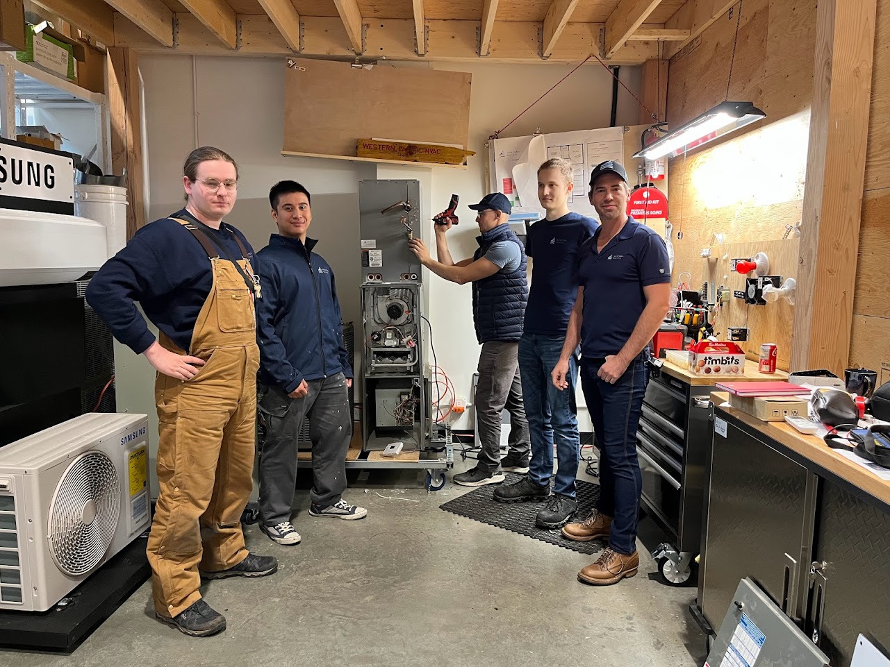 Western Pacific HVAC technicians together in the company workshop