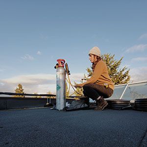 Western Pacific technician working on a rooftop